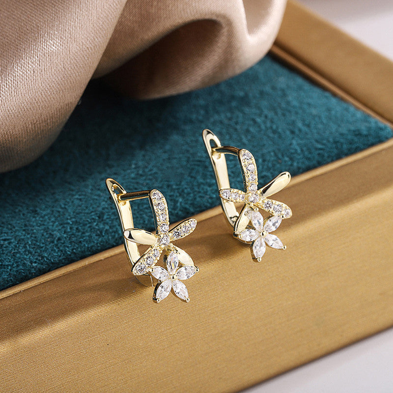 Gold Plated American Diamond Studded Dual Star Shaped Clip-On Earrings