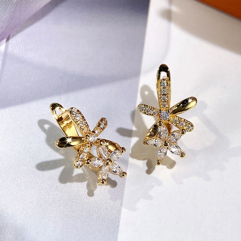 Gold Plated American Diamond Studded Dual Star Shaped Clip-On Earrings