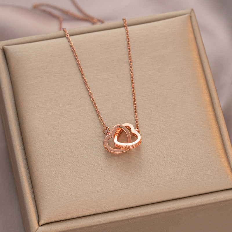 Rose Gold Plated American Diamond Studded Dual Hearts Pendant