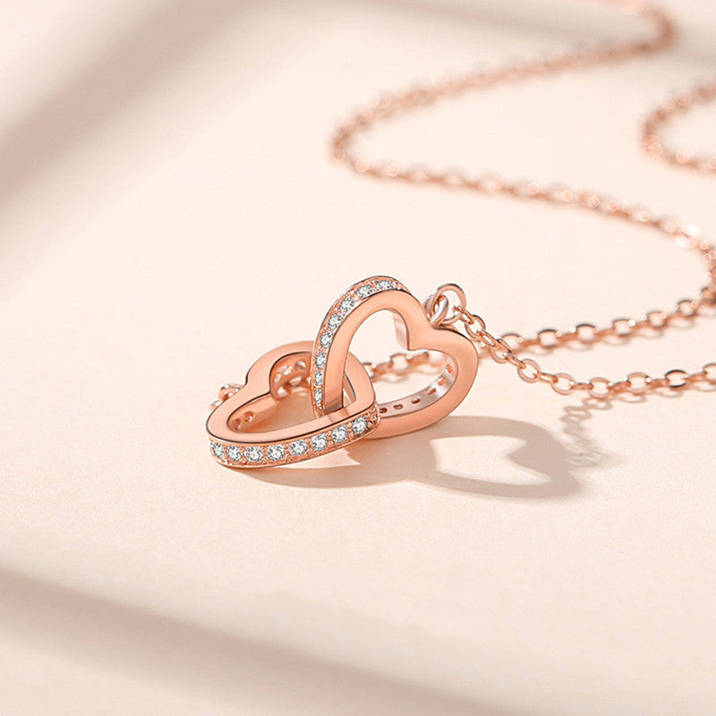 Rose Gold Plated American Diamond Studded Dual Hearts Pendant