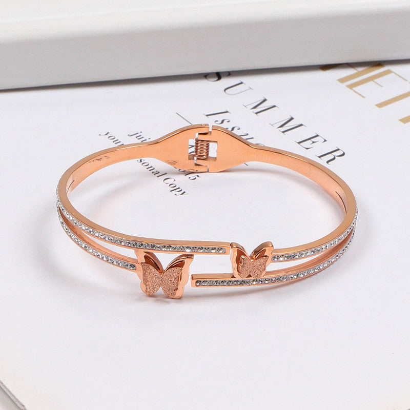 Stainless Steel Rose Gold Plated Butterfly inspired American Diamond Studded Bracelet For Women