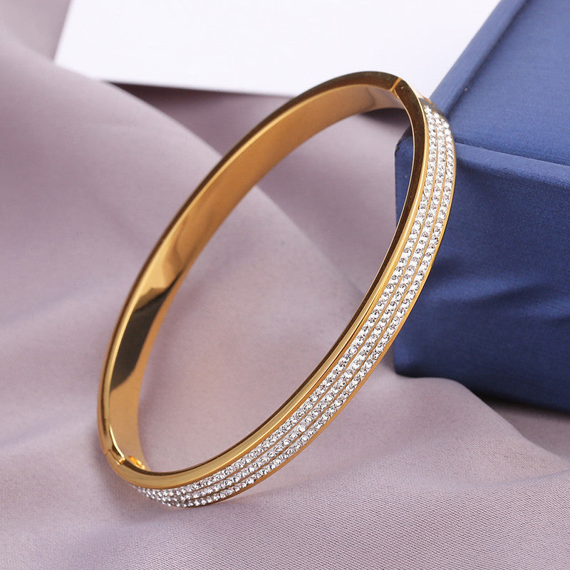 Stainless Steel Gold Plated Triple Lines American Diamond Contemporary Anti-Tarnish Bracelet For Women