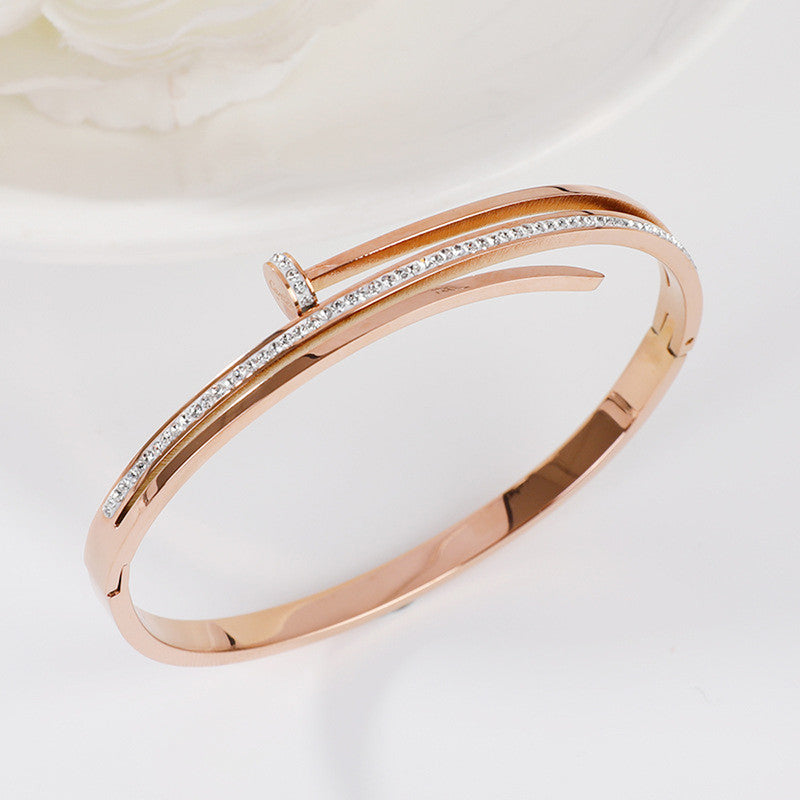 Stainless Steel Rose Gold Plated American Diamond Studded Nail Bracelet For Women